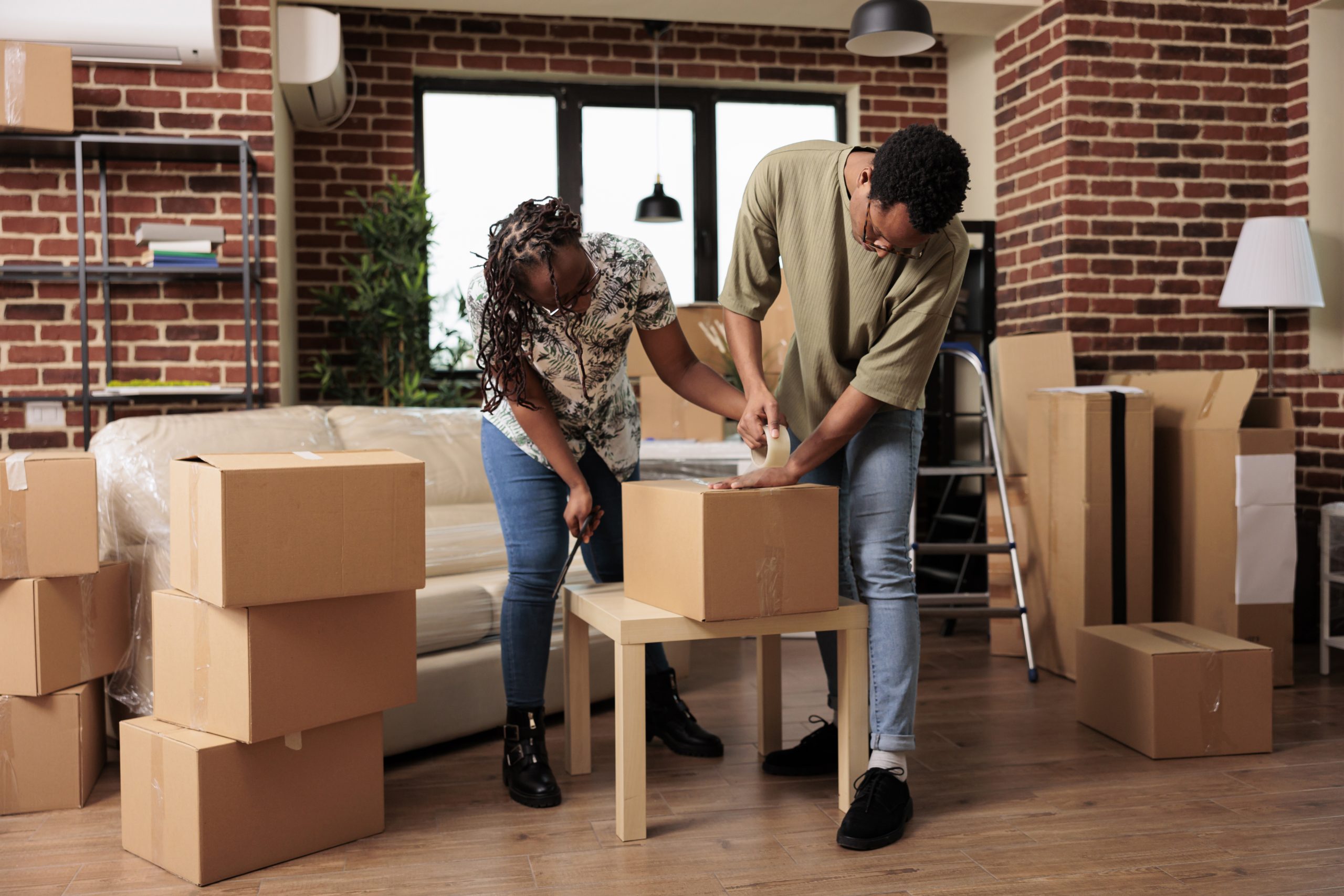 Home buyers unpacking boxes
