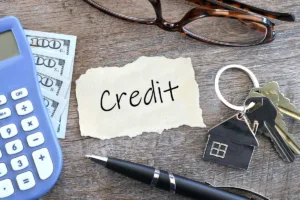 Credit history on paper on a desk with keys