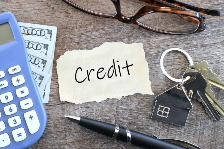 Credit history on paper on a desk with keys