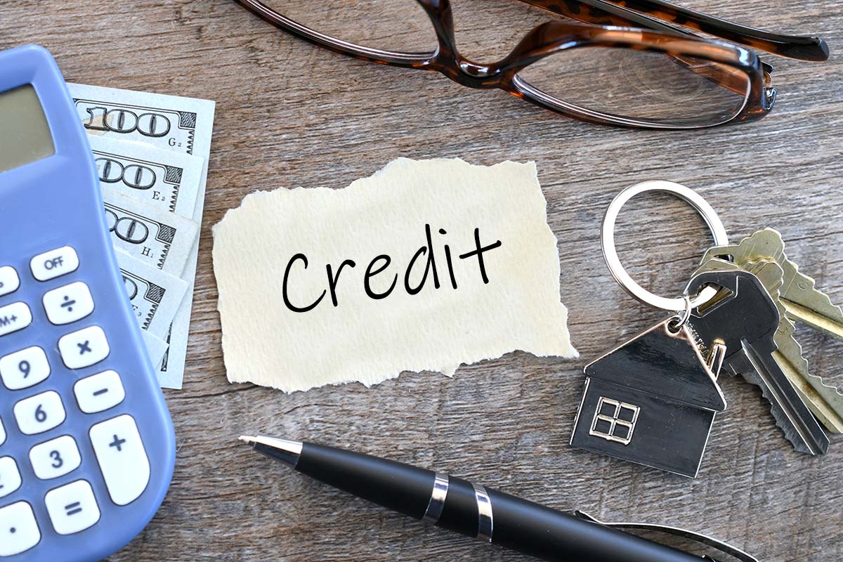 Credit history on paper on a desk with keys