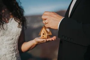 Bride and Groom with a home