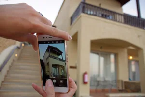 Taking a photo of the exterior of a house.
